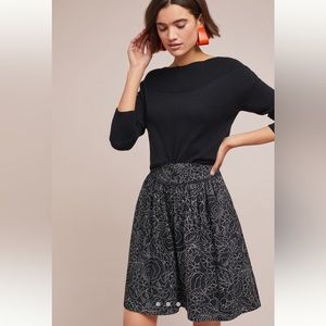 Black Anthropologie skirt with white floral pattern.